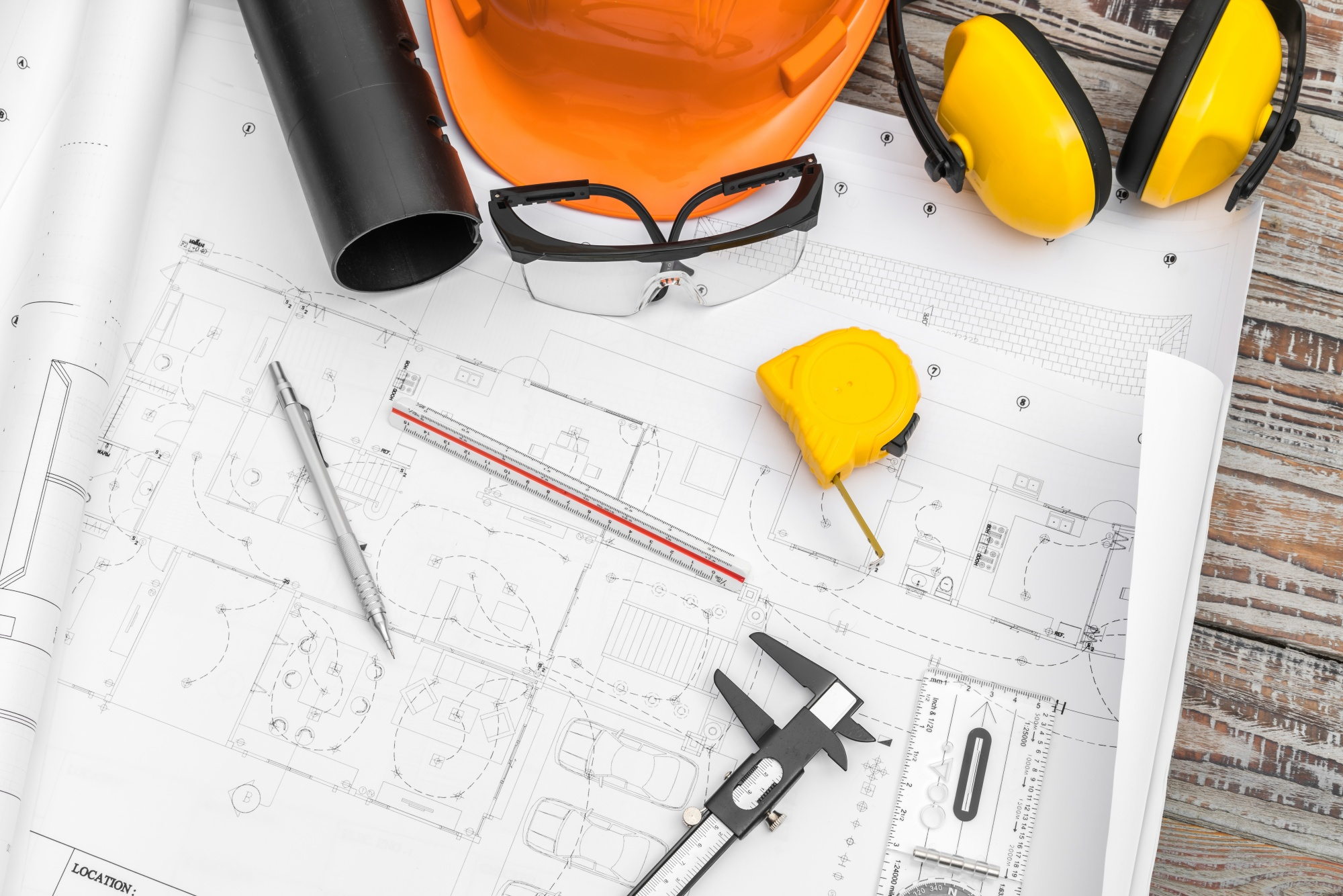 Construction blueprints and safety equipment